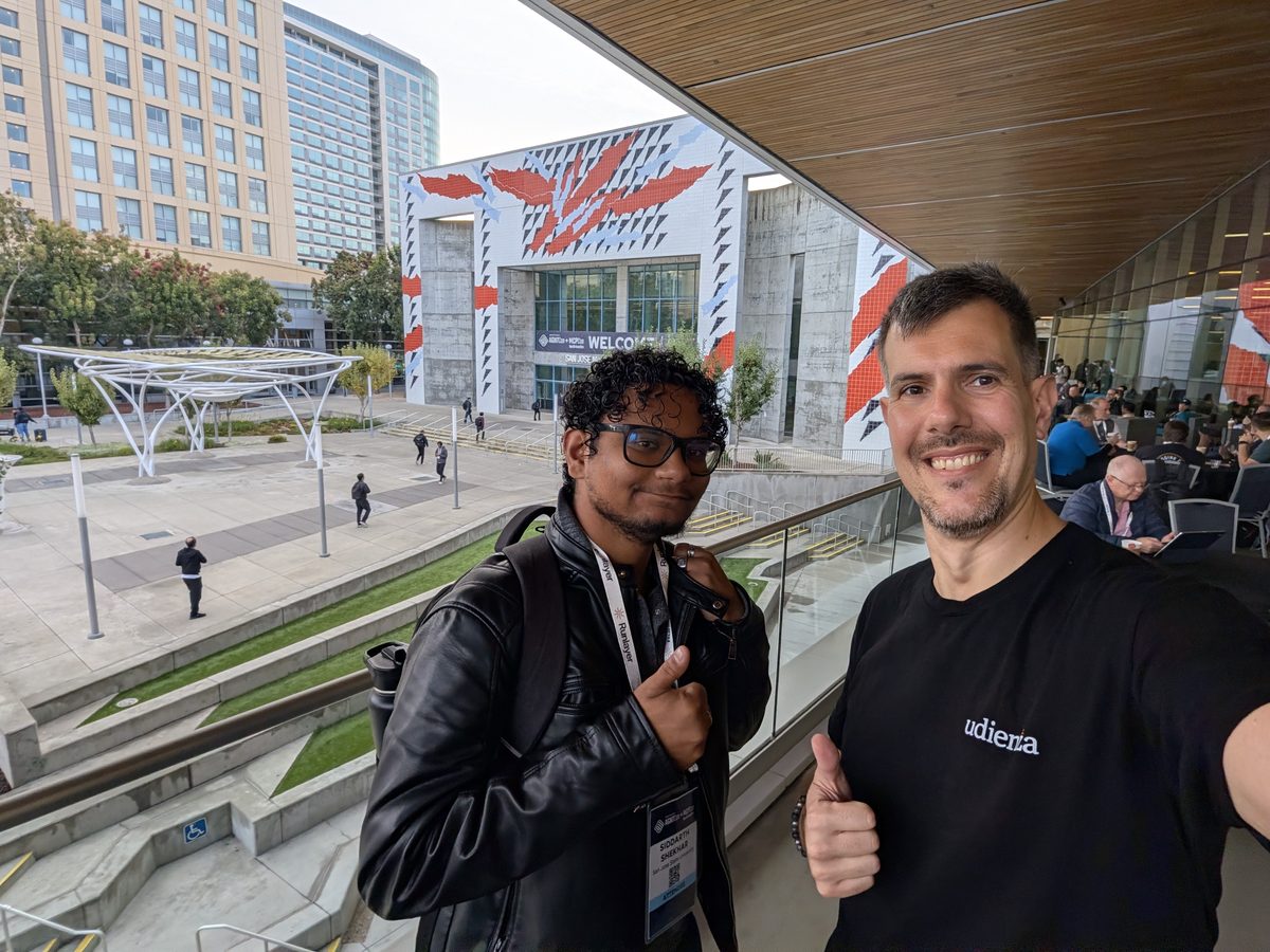 Luca Berton and Siddarth Shekhar, a student at San Jose State University, giving a thumbs-up on the convention center terrace