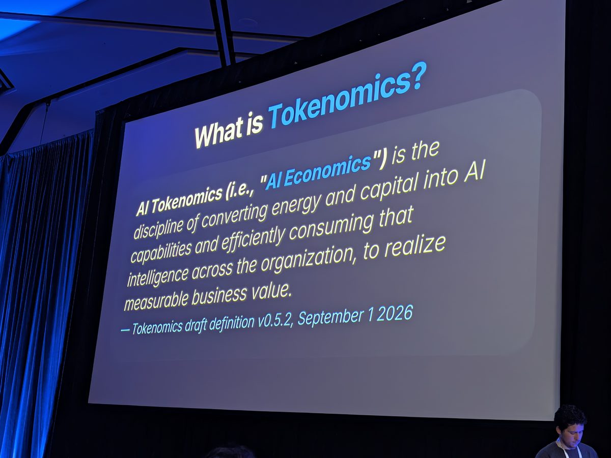 A slide titled What is Tokenomics? with the Tokenomics Foundation's draft definition of AI tokenomics, version 0.5.2, 1 September 2026
