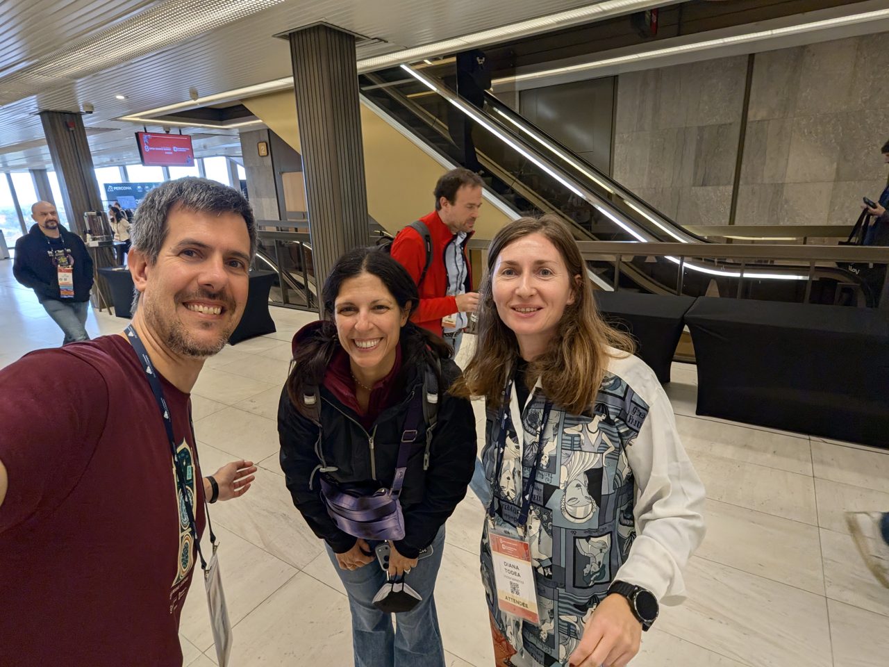 The host with Diana Todea and another attendee in the main hall