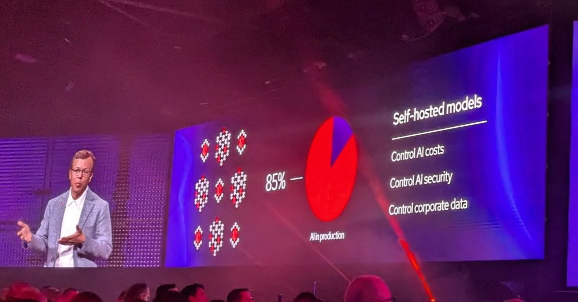 A keynote slide headed Self-hosted models, listing control AI costs, control AI security and control corporate data beside an 85% figure